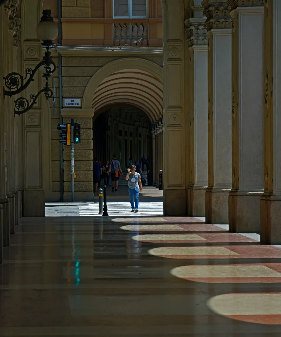 Decorated columns and repeating arches near Via Castiglione in central Bologna
